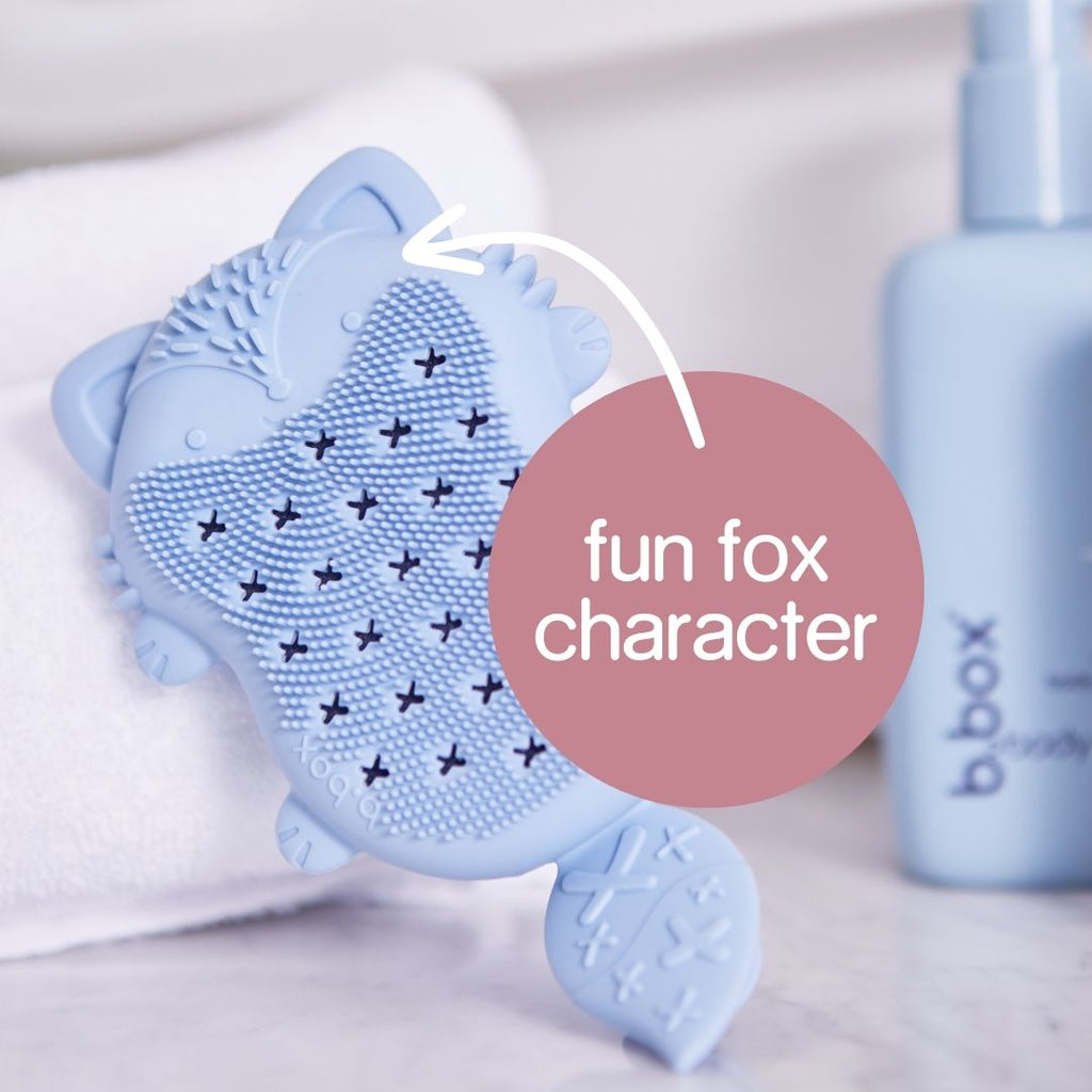 Silicone Baby Bath Brush in a Fun Fox Character standing next to b.box body Cleanse Hair + Body Wash
