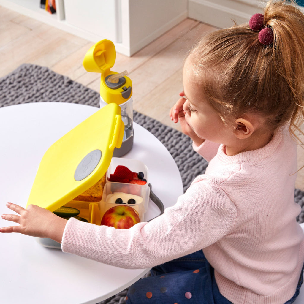 child with lunchbox - lemon sherbet - b.box for kids