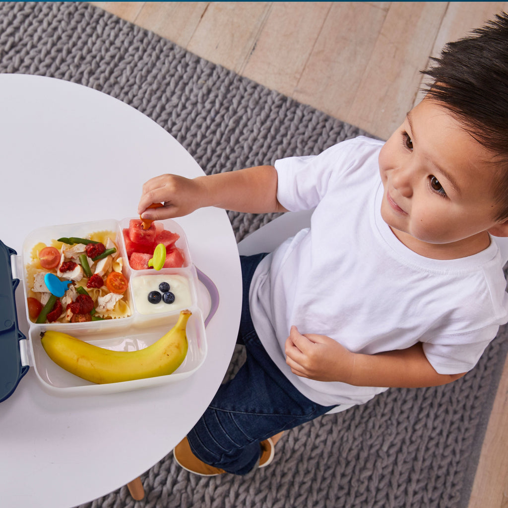 child with lunchbox - strawberry shake - b.box for kids