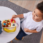 child with lunchbox - strawberry shake - b.box for kids