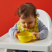 child with silicone first feeding set - lemon sherbet - b.box for kids