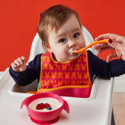 child with silicone first feeding set - strawberry shake - b.box for kids